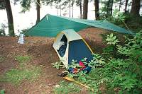 Overnight, a 10 hour storm dropped 2 inches of rain. The tent stayed dry. And, the tarp allowed everything to be packed up dry while the rain still fell.